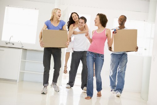 Loading furniture into a moving van for a flat move in Belsizepark