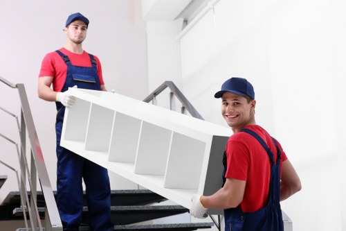 Removals team preparing items safely with protective wrapping