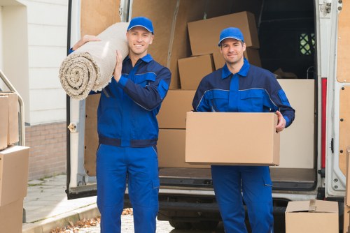 Removal team loading boxes for a move in Belsizepark