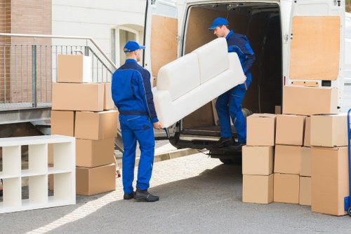 Moving boxes and a checklist representing the first stage of a removals complaint process