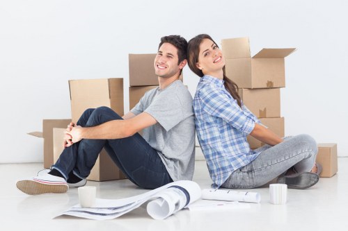 Preparing packed boxes for a local move with a moving van in Belsizepark