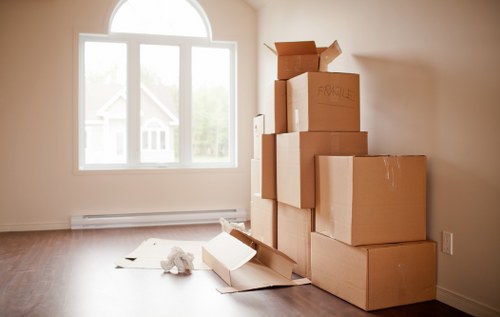 Local removals team planning a move in Belsize Park with boxes and furniture