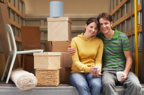 Packed household boxes and furniture ready for loading in North West London