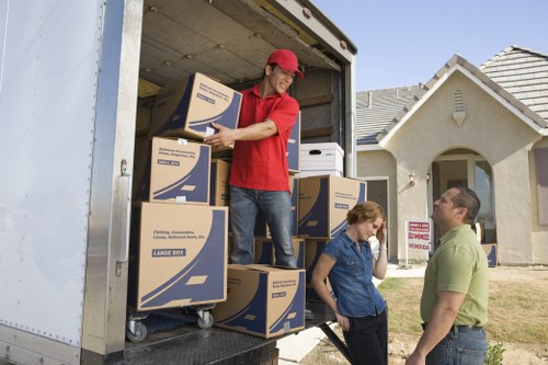 Removals crew handling furniture during a scheduled move