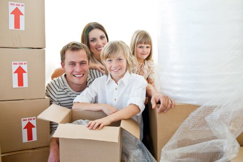 Packed boxes and furniture prepared for a local move in Belsizepark