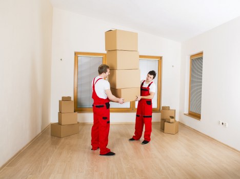 Packed boxes and furniture prepared for a flat move in Belsizepark
